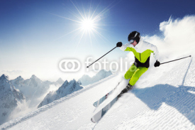 Obrazy i plakaty Skier in mountains, prepared piste and sunny day