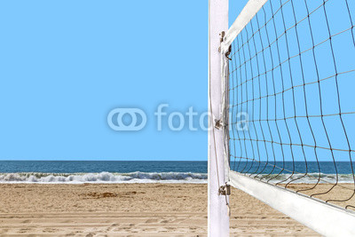 Close up of beach volleyball net mounted wood post