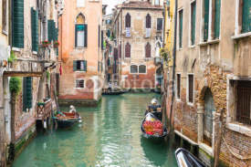 Naklejki Canal with gondolas in Venice, Italy