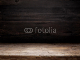 wooden table and dark wooden wall