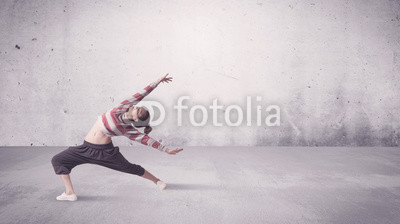 Pretty urban dancer with empty background