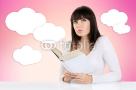 girl daydreaming while reading a book and looking up on a pink b