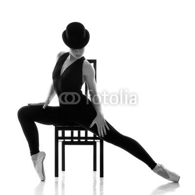 pretty young ballerina sitting on the chair.