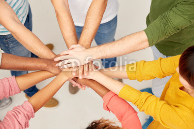 group of international people with hands together