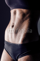 Naklejki closeup studio shot fitness woman abs