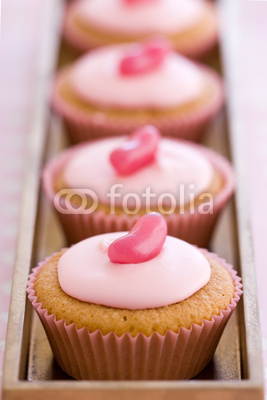Row of pink cupcakes