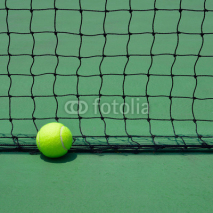 Naklejki tennis ball on green court