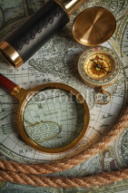 Fototapety Magnifying glass, compass, telescope and map