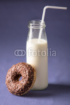Fototapety Donut with milk at violet background