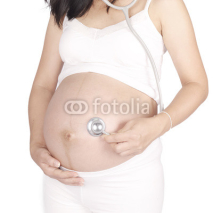 Naklejki Close up of a cute pregnant belly