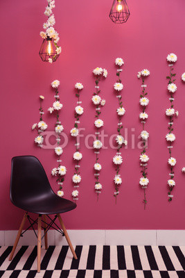 Wall decorated with flower garland