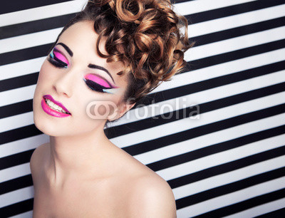 Beautiful young woman with professional party make up