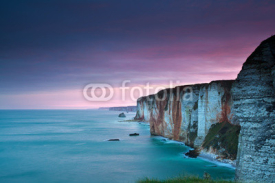 purple sunrise over Atlantic ocean and cliffs