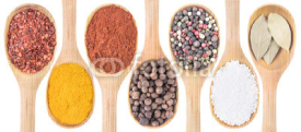 Collection of 7 spices on a wooden spoon