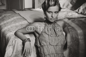 Naklejki Portrait of a beauty woman in stylish room in black and white