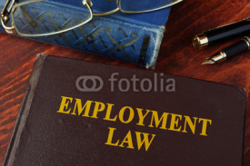 Naklejki Book with title employment law on a table.