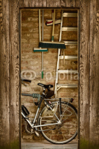 Fototapety Retro styled image of a shed with a bicycle inside