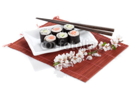 Fototapety Sushi maki set with salmon and cucumber and sakura branch