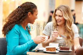 Naklejki Two Female Friends Meeting In Café
