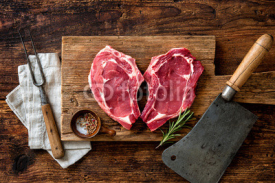Naklejki Heart shape raw fresh veal meat steaks
