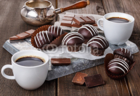Fototapety Chocolate muffins on dark wooden background