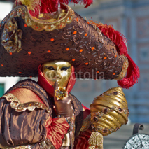 Naklejki Person in Venetian costume attends Carnival of Venice.