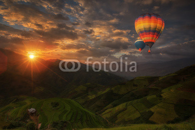 Hot air balloon over Rice fields on terraced