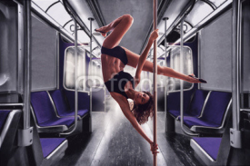 Fototapety Beautiful woman performing pole dance.Collage in train  background.
