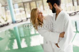 Happy couple relaxing at wellness spa center