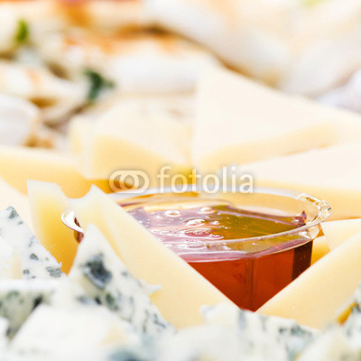 Cheese appetizer with honey macro. Dor Blue Cheese plate with  h