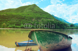 Naklejki Two boats in river on the picturesque landscape