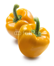 Naklejki Two yellow bell pepper isolated on white background
