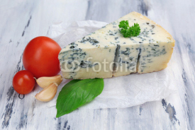 Naklejki Tasty blue cheese on old wooden table