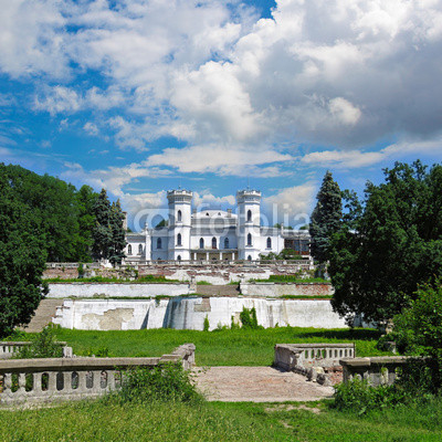 The White Swan palace on sky background. Sharovka, Ukraine.