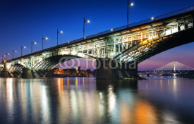Two bridges illuminated in Warsaw