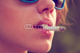 Naklejki woman smoke a cigarette