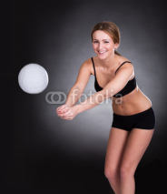 Obrazy i plakaty Young Woman Playing Volleyball
