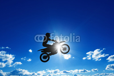 Jumping motorcycle rider