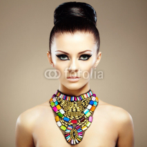 Naklejki Portrait of young beautiful woman with jewelry