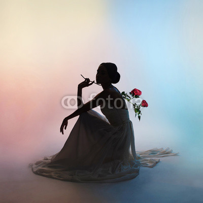 Silhouette elegant woman on colors background
