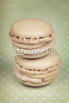 Fototapety Two macaroons on green polka dots background