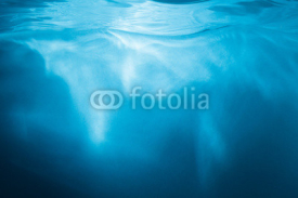 Obrazy i plakaty Abstract blue background. Water with sunbeams
