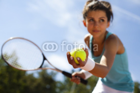 Naklejki Girl playing tennis on the court