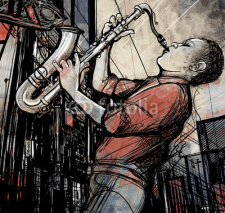 Naklejki saxophone player in a street at night
