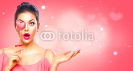 Valentine's Day. Beauty surprised young fashion model girl with Valentine heart shaped cookie