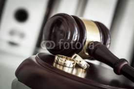 Naklejki Divorce concept with gavel and wedding rings