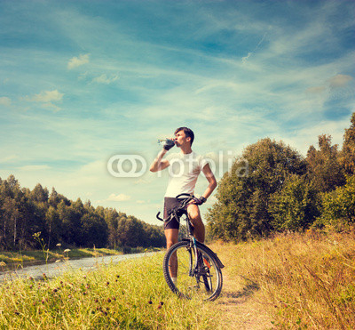 Man Riding a Bicycle on Nature Background