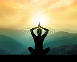 Obrazy i plakaty Yoga and meditation. Silhouette of man in moontains.