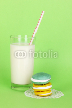 Naklejki Glass of fresh new milk with cake on green background