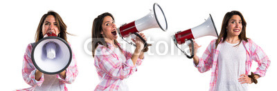 Young girl shouting by megaphone